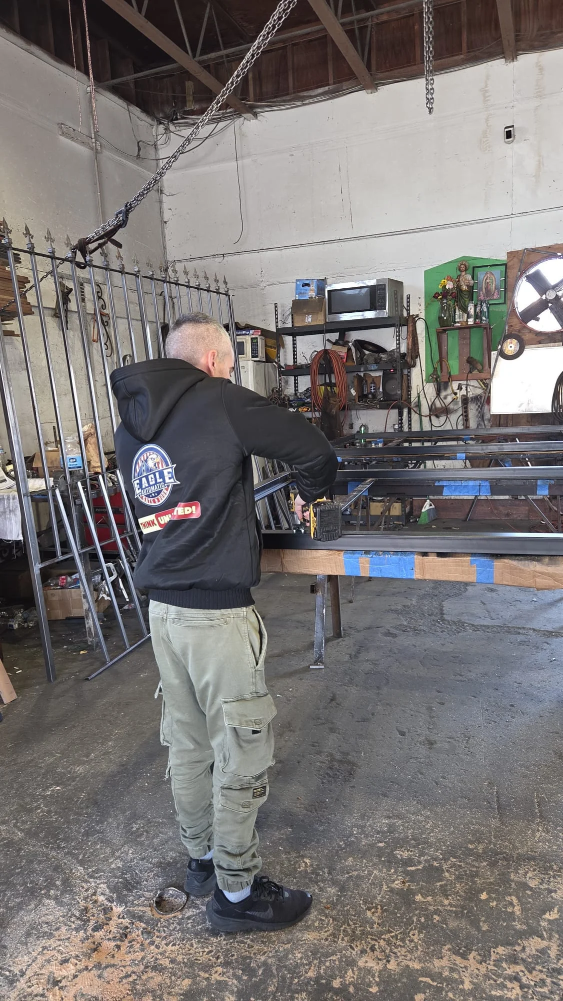 Eagle metalworker fabricating a gate in the workshop