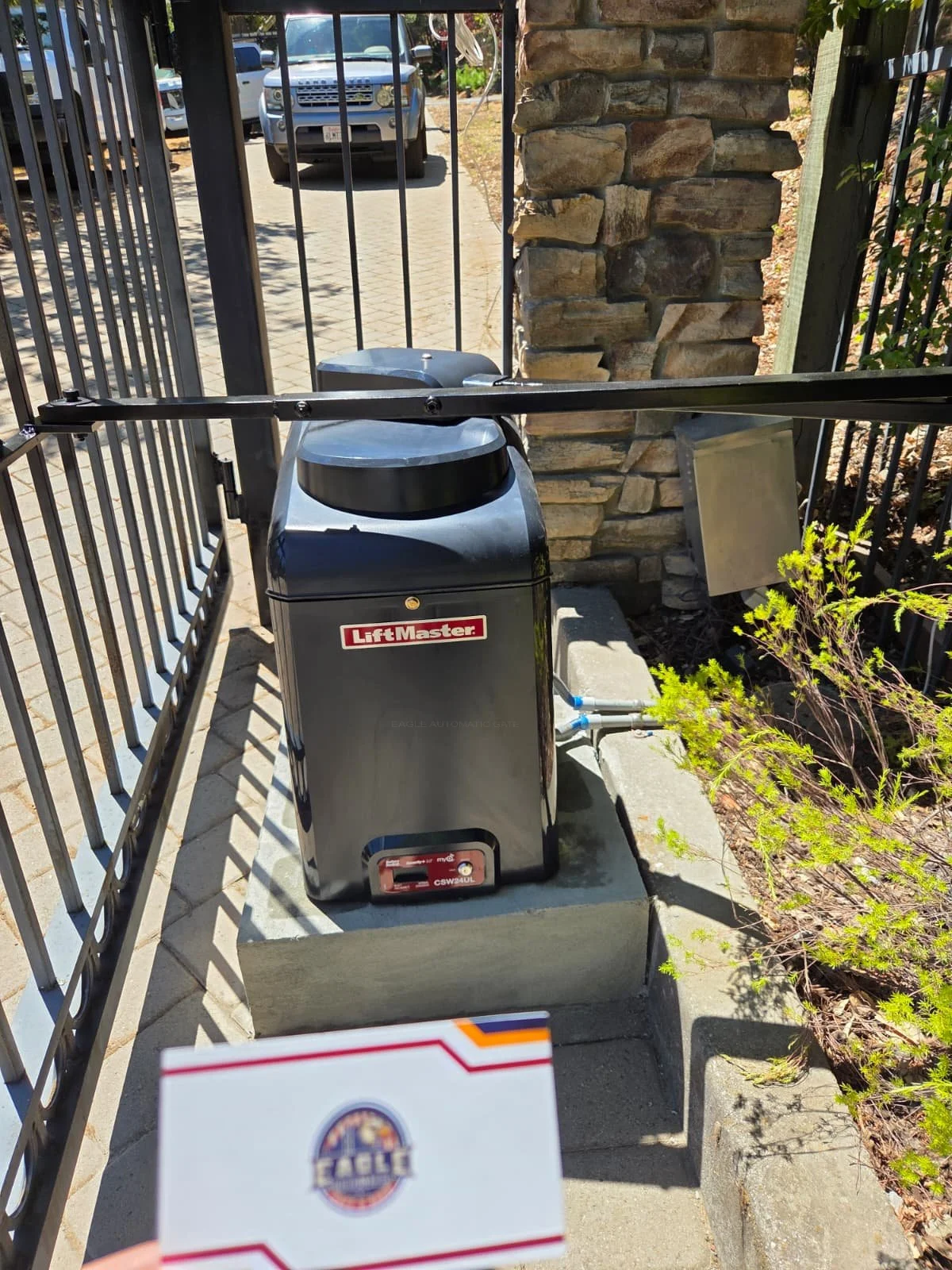 Installed LiftMaster CSW24UL swing-gate operator