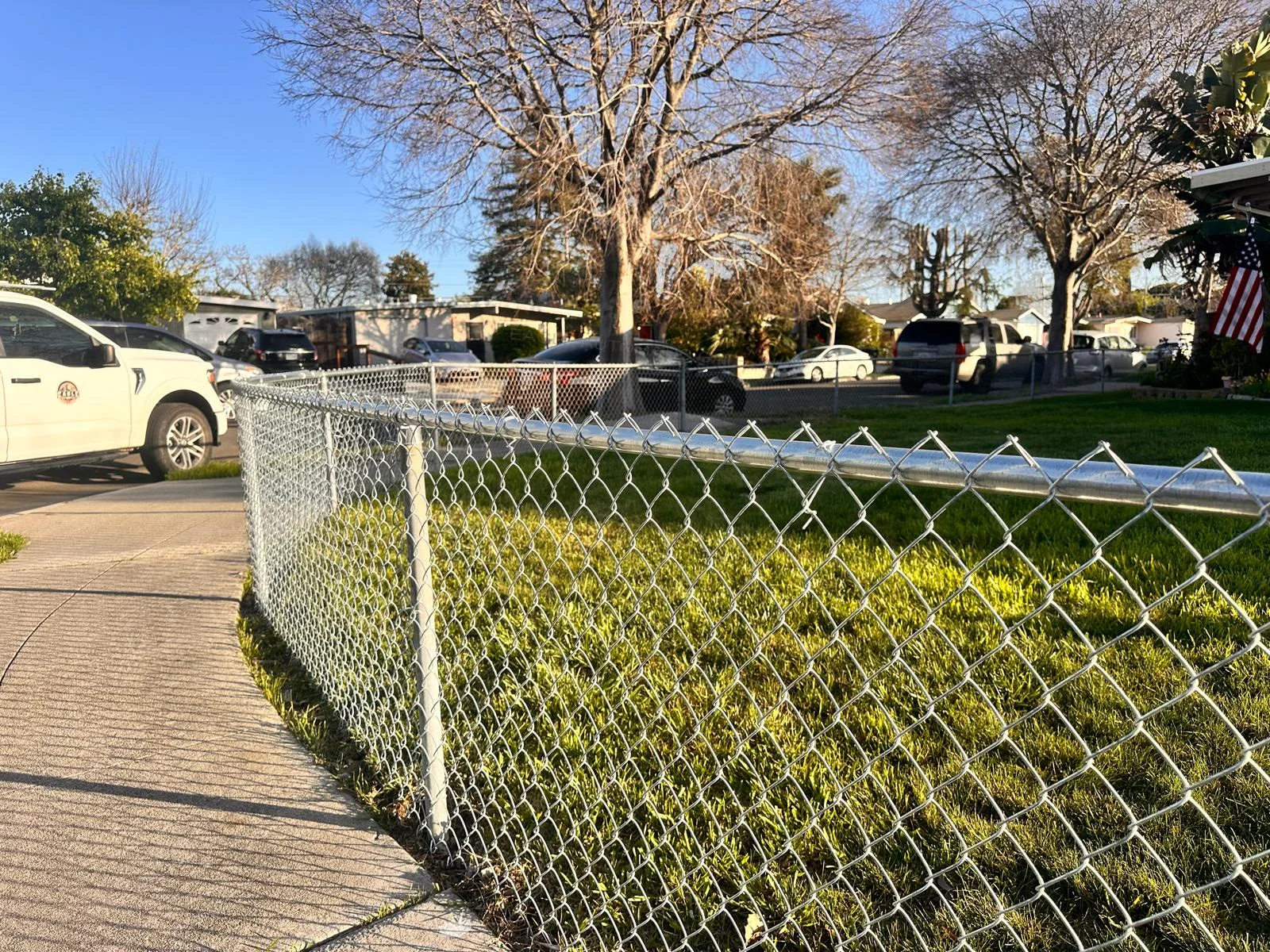 New chain-link fence along a residential boundary