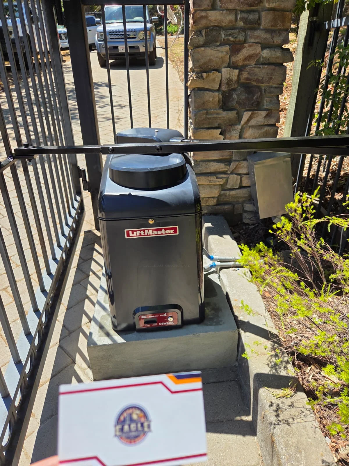 Installed LiftMaster CSW24UL swing-gate operator