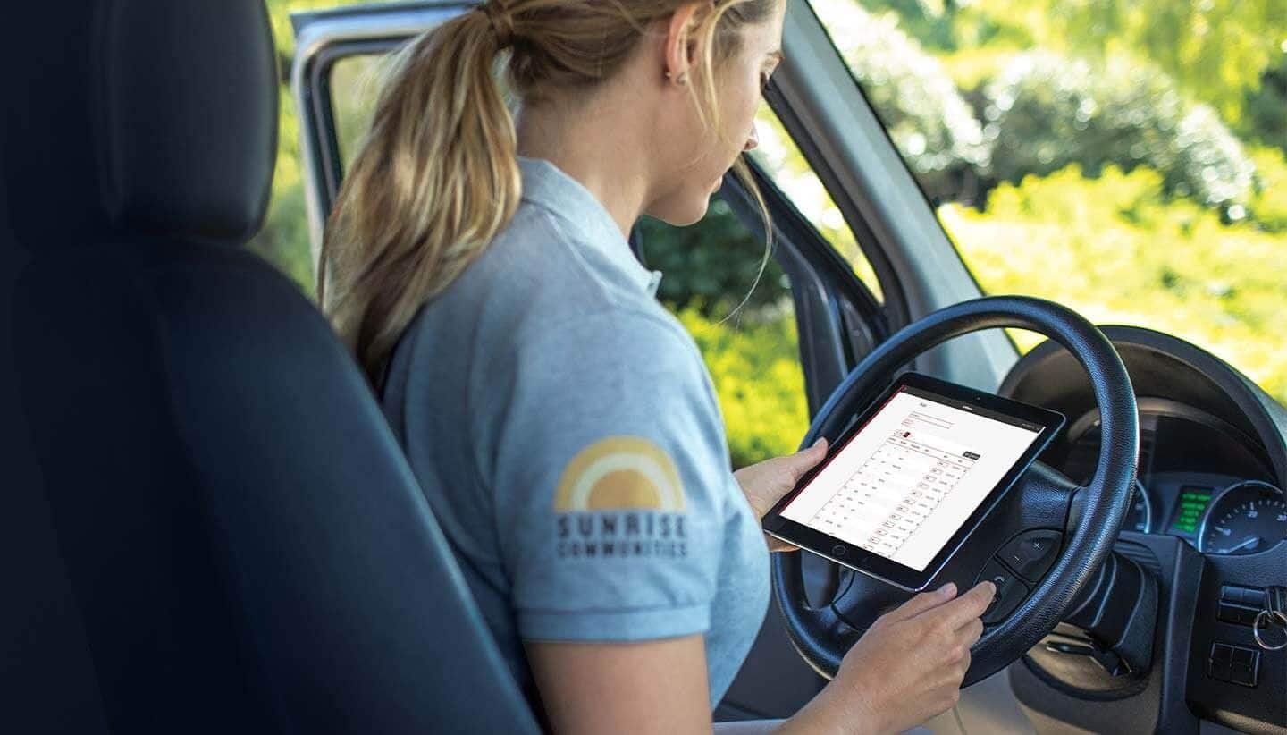 Person using a tablet for connected access management