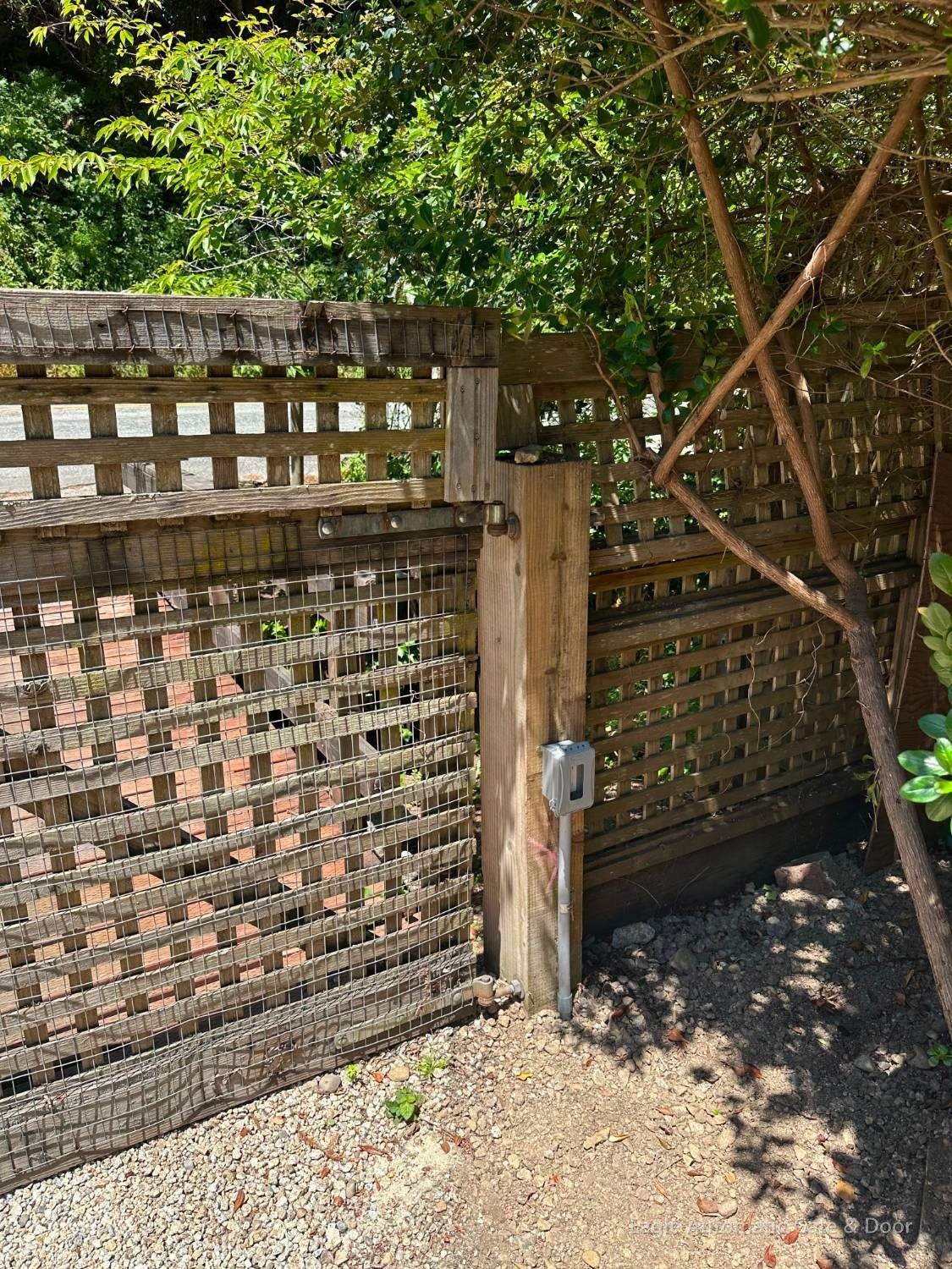 Old lattice gate hinge and supporting post