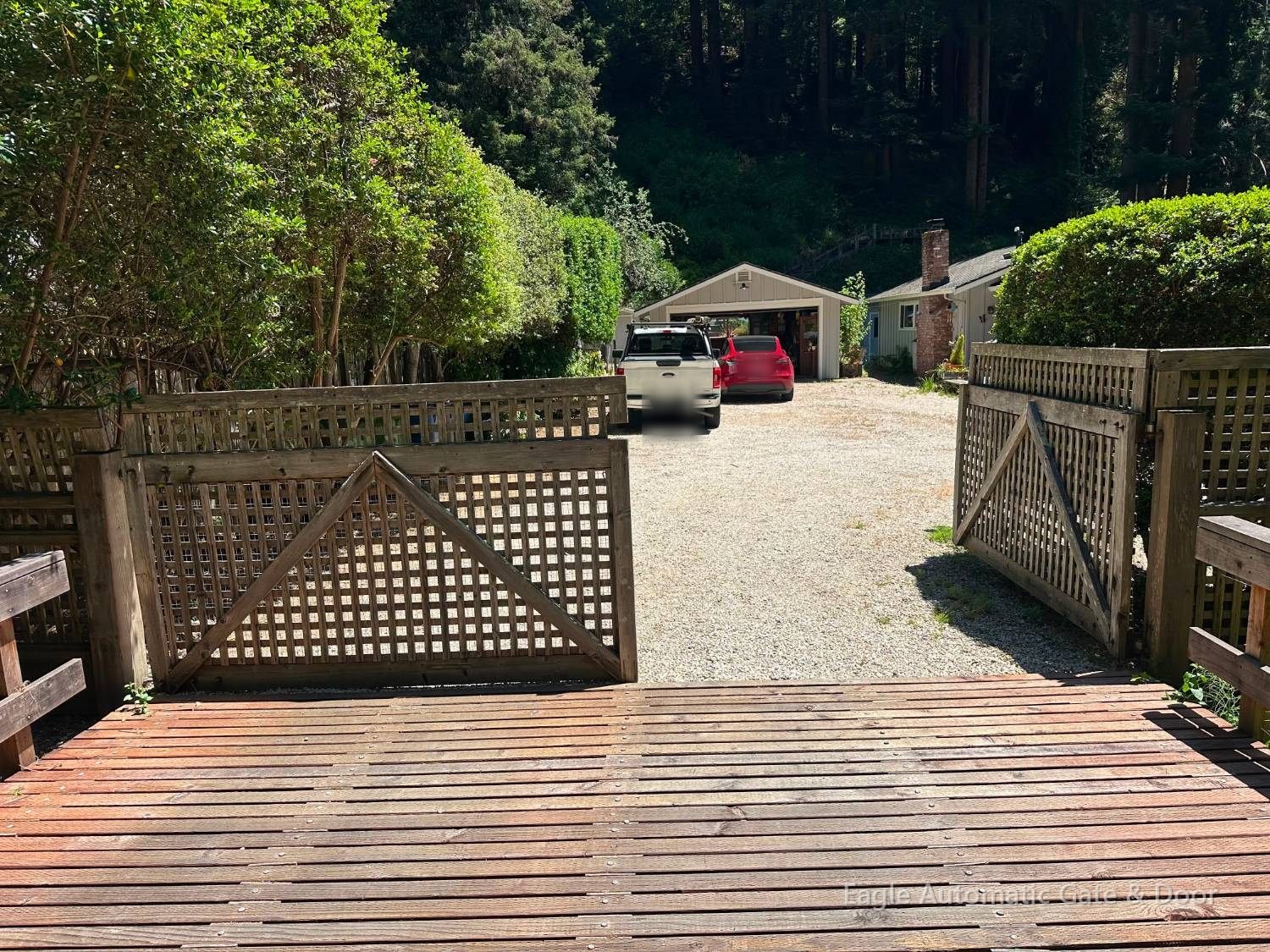 Old lattice driveway gates before replacement
