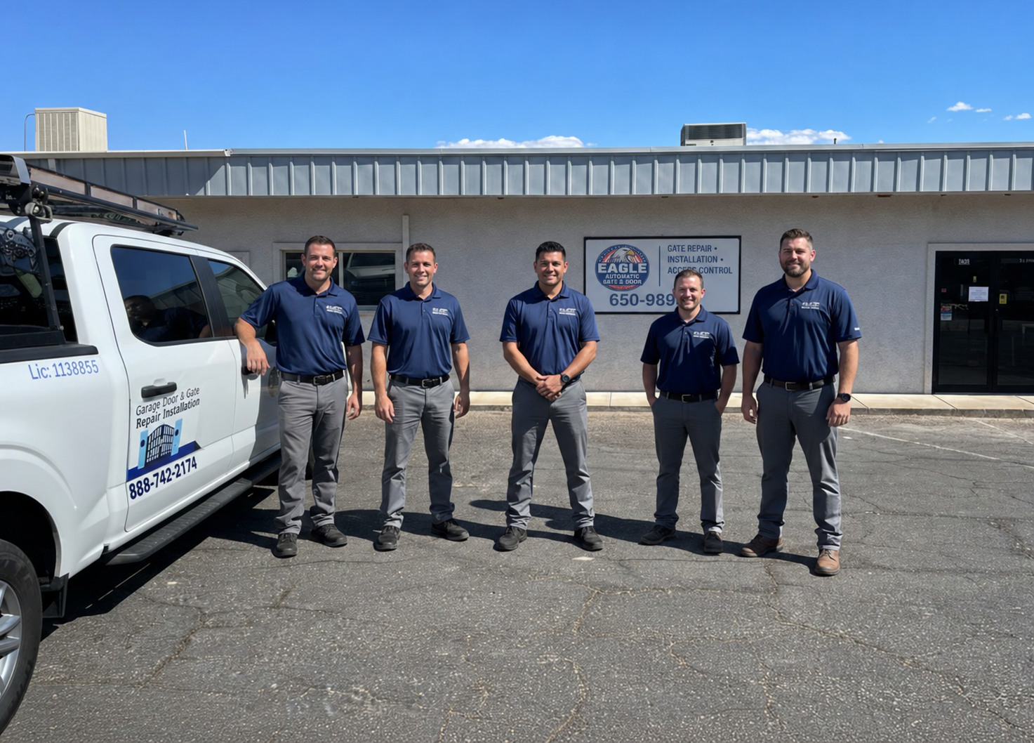 Eagle gate team beside the service truck and building