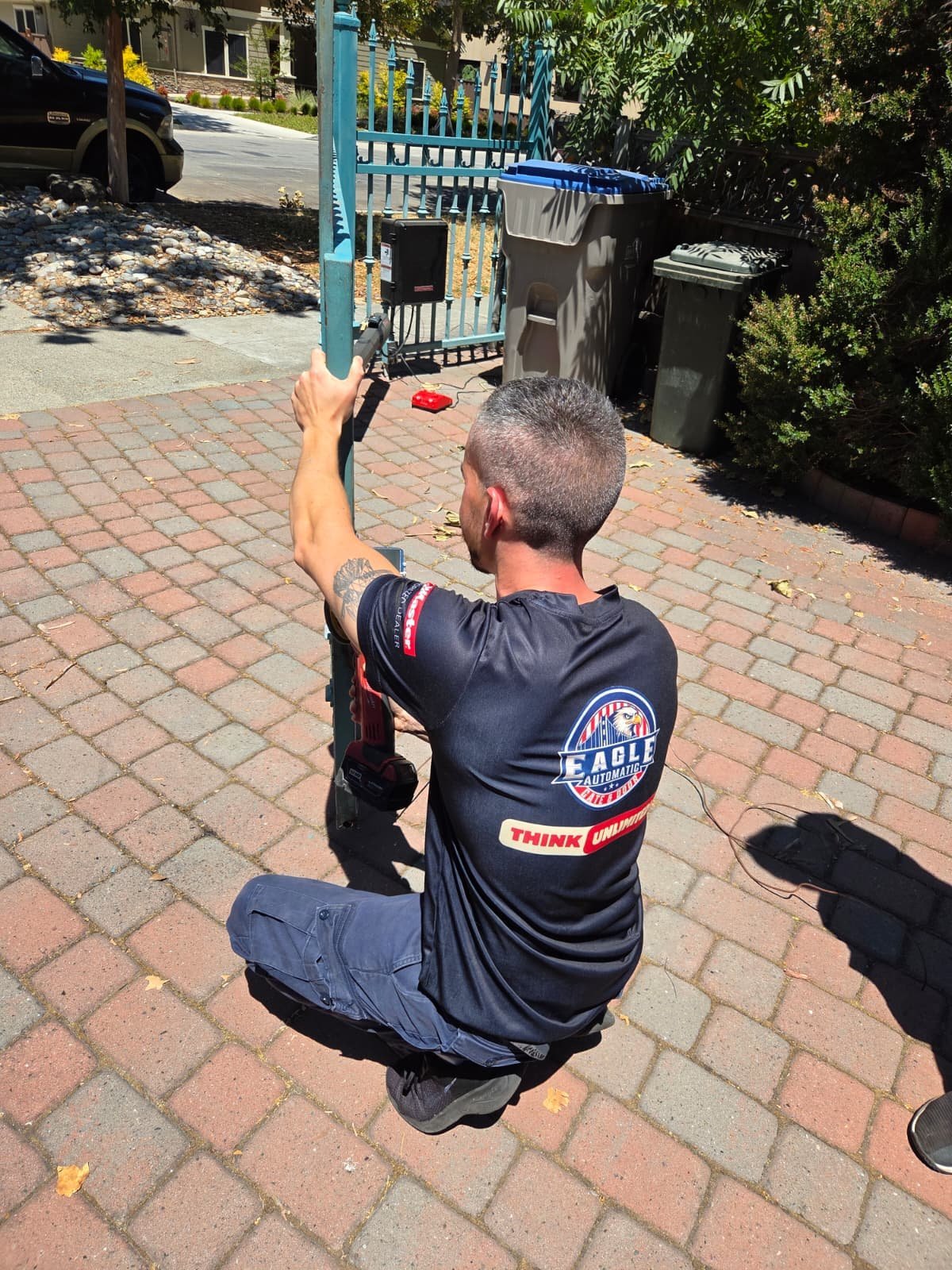 Eagle technician repairing an automatic gate